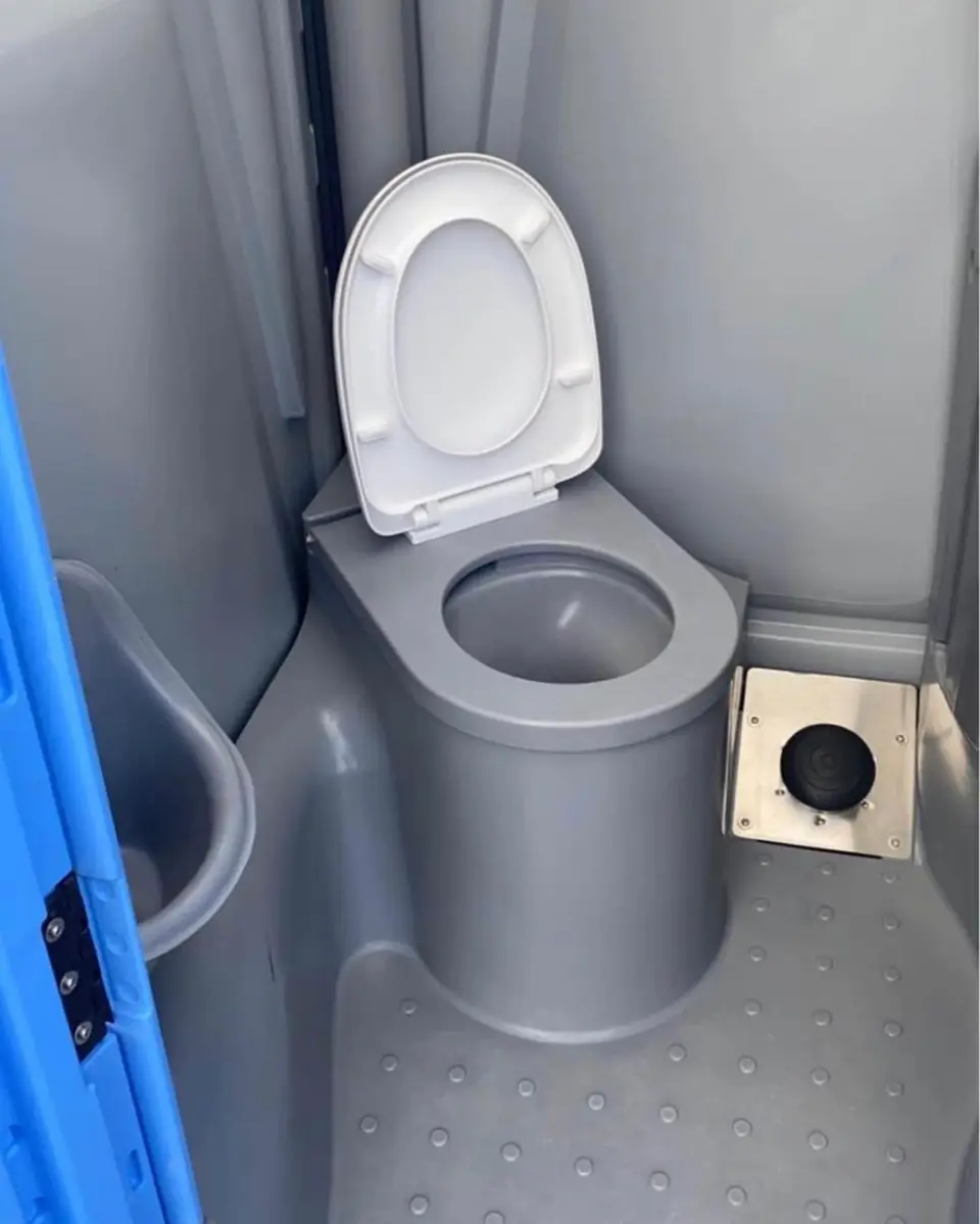 Gray deluxe portable toilet interior with toilet seat and lid