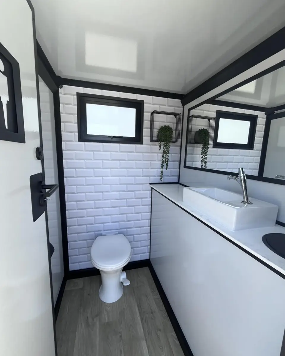 Luxury restroom interior with flushing toilet and vanity sink